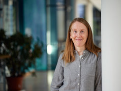 Hannah Rowland in the hallway of the Max Planck Institute.