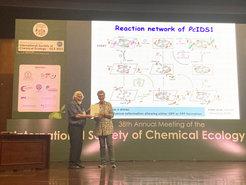 ISCE president Nicole van Dam presents the ISCE Silver Medal to Wilhelm Boland after his award lecture.